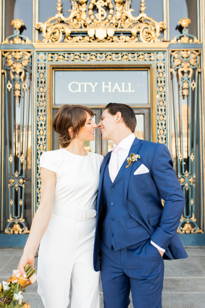 Bride and groom standing in front of the San Francisco court house. Photos by Shannon Alyse Photography