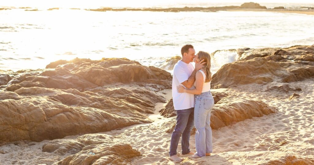 Angela and Mike share a tender moment on Bean Hollow State Beach near Santa Cruz, California.